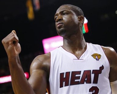 Miami Heat guard Dwyane Wade reacts to the play in his game against the Oklahoma City Thunder in the first half during Game 3 of the NBA bas Miami Heat guard Dwyane Wade reacts to the play in his game against the Oklahoma City Thunder in the first half during Game 3 of the NBA bas