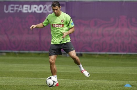Portugal's Cristiano Ronaldo controls the ball during a training session for the Euro 2012 soccer tournament at training field in Opalenica Portugal's Cristiano Ronaldo controls the ball during a training session for the Euro 2012 soccer tournament at training field in Opalenica