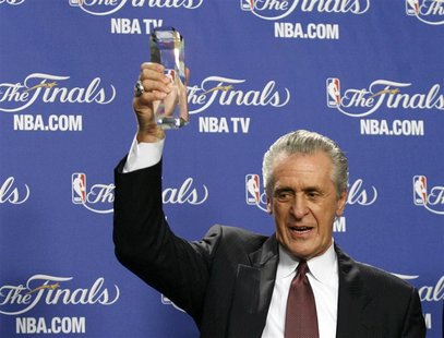 Miami Heat President Pat Riley holds the 2012 Chuck Daly Lifetime Achievement Award after it was presented to him before the start of play b Miami Heat President Pat Riley holds the 2012 Chuck Daly Lifetime Achievement Award after it was presented to him before the start of play b