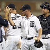 Detroit Tigers closer pitcher Phil Coke (2nd R) and catcher Gerald Laird (R) celebrate with teammates after their victory over the Saint Lou