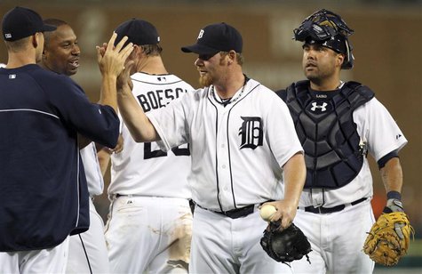 Detroit Tigers closer pitcher Phil Coke (2nd R) and catcher Gerald Laird (R) celebrate with teammates after their victory over the Saint Lou Detroit Tigers closer pitcher Phil Coke (2nd R) and catcher Gerald Laird (R) celebrate with teammates after their victory over the Saint Lou