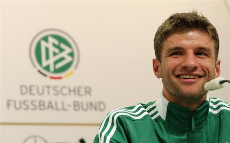 Germany's national soccer player Thomas Mueller smiles during a news conference before their Euro 2012 soccer match against Greece in Gdansk Germany's national soccer player Thomas Mueller smiles during a news conference before their Euro 2012 soccer match against Greece in Gdansk
