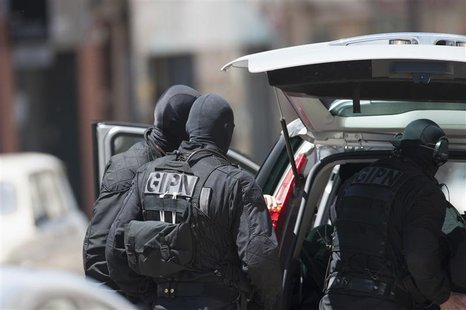 Special French GIPN intervention police arrive at the scene where a man claiming to be a member of al Qaeda has taken four hostages, includi Special French GIPN intervention police arrive at the scene where a man claiming to be a member of al Qaeda has taken four hostages, includi