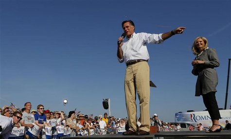 U.S. Republican presidential candidate Mitt Romney and his wife Ann, address a crowd during a campaign event at Holland State Park in Michig U.S. Republican presidential candidate Mitt Romney and his wife Ann, address a crowd during a campaign event at Holland State Park in Michig