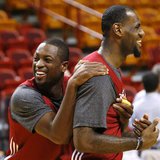 Miami Heat players Dwyane Wade (L) and LeBron James (R) joke around during a team practice at the NBA basketball finals in Miami June 20, 20