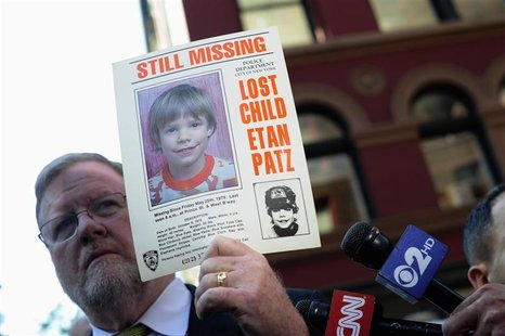 New York Police Department spokesman Paul Brown holds an original missing poster of Etan Patz during a news conference near a New York City New York Police Department spokesman Paul Brown holds an original missing poster of Etan Patz during a news conference near a New York City