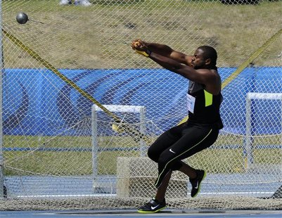 Kibwe Johnson of the U.S. throws the hammer to a first-place finish at the Donovan Bailey Invitational track and field meet in Edmonton, Alb Kibwe Johnson of the U.S. throws the hammer to a first-place finish at the Donovan Bailey Invitational track and field meet in Edmonton, Alb