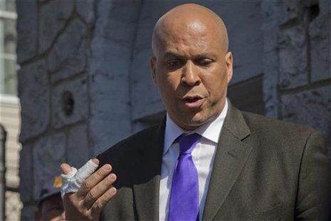 Newark Mayor Cory Booker speaks to the media outside a burned house in Newark, New Jersey, April 13, 2012. REUTERS/Eduardo Munoz Newark Mayor Cory Booker speaks to the media outside a burned house in Newark, New Jersey, April 13, 2012. REUTERS/Eduardo Munoz