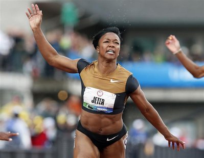Carmelita Jeter crosses the finish line to win the women's 100 meters at the U.S. Olympic athletics trials in Eugene, Oregon, June 23, 2012. Carmelita Jeter crosses the finish line to win the women's 100 meters at the U.S. Olympic athletics trials in Eugene, Oregon, June 23, 2012.