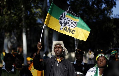 An African National Congress (ANC) supporter holds the party's flag during a march to the Goodman Gallery in Johannesburg May 29, 2012, wher An African National Congress (ANC) supporter holds the party's flag during a march to the Goodman Gallery in Johannesburg May 29, 2012, wher
