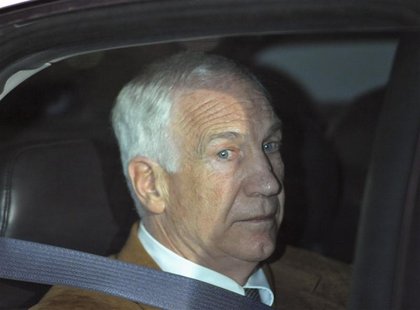 Former Penn State assistant football coach Jerry Sandusky leaves the Centre County Courthouse after his conviction in his child sex abuse tr Former Penn State assistant football coach Jerry Sandusky leaves the Centre County Courthouse after his conviction in his child sex abuse tr