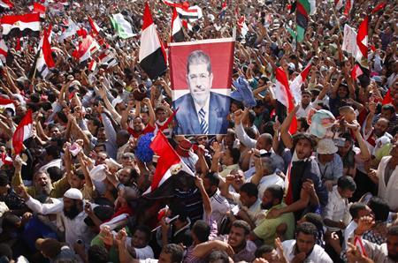 Supporters of Muslim Brotherhood's presidential candidate Mohamed Morsy celebrate his victory at the election at Tahrir Square in Cairo June 24, 2012. Credit: REUTERS/Ahmed Jadallah Supporters of Muslim Brotherhood's presidential candidate Mohamed Morsy celebrate his victory at the election at Tahrir Square in Cairo June 24, 2012. Credit: REUTERS/Ahmed Jadallah