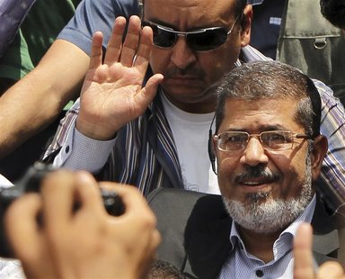 Mohamed Morsy waves to his supporters after Friday prayers in Cairo in this June 22, 2012 file photo. REUTERS/Suhaib Salem/Files Mohamed Morsy waves to his supporters after Friday prayers in Cairo in this June 22, 2012 file photo. REUTERS/Suhaib Salem/Files