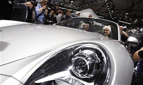 CEO of German carmaker Porsche Matthias Mueller (R) and President and CEO of Porsche Automobil Holding SE Martin Winterkorn (L) sit in a Por CEO of German carmaker Porsche Matthias Mueller (R) and President and CEO of Porsche Automobil Holding SE Martin Winterkorn (L) sit in a Por