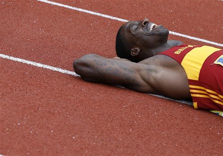 Dwain Chambers lies on the track after winning the men's 100 metres final at the British Olympic athletics trials at the Alexander Stadium i Dwain Chambers lies on the track after winning the men's 100 metres final at the British Olympic athletics trials at the Alexander Stadium i