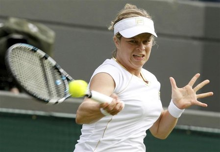 Kim Clijsters of Belgium hits a return to Jelena Jankovic of Serbia during their women's singles tennis match at the Wimbledon tennis champi Kim Clijsters of Belgium hits a return to Jelena Jankovic of Serbia during their women's singles tennis match at the Wimbledon tennis champi