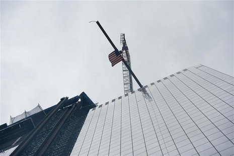 The final steel beam to be installed on 4 World Trade Center is raised during a ceremony to mark its installation in New York, June 25, 2012 The final steel beam to be installed on 4 World Trade Center is raised during a ceremony to mark its installation in New York, June 25, 2012