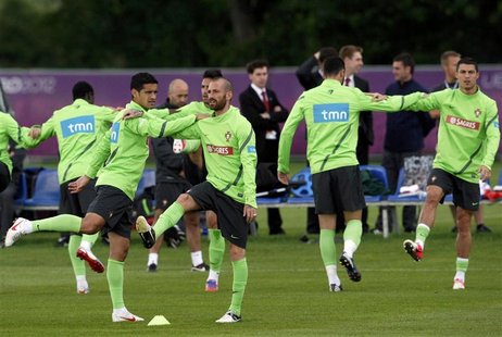 Portugal's Miguel Veloso, Ricardo Costa, Raul Meireles and Cristiano Ronaldo (L to R) attend a training session during the Euro 2012 soccer Portugal's Miguel Veloso, Ricardo Costa, Raul Meireles and Cristiano Ronaldo (L to R) attend a training session during the Euro 2012 soccer