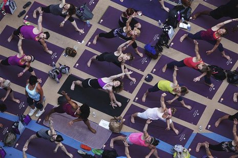 People practice yoga on the morning of the summer solstice in New York's Times Square June 20, 2012. REUTERS/Shannon Stapleton People practice yoga on the morning of the summer solstice in New York's Times Square June 20, 2012. REUTERS/Shannon Stapleton