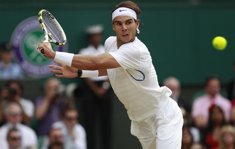 Rafael Nadal of Spain hits a return to Novak Djokovic of Serbia during their men's singles final match at the Wimbledon tennis championships Rafael Nadal of Spain hits a return to Novak Djokovic of Serbia during their men's singles final match at the Wimbledon tennis championships