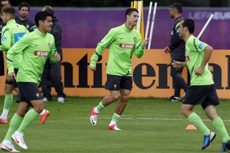 Portugal's Cristiano Ronaldo attends a training session during the Euro 2012 soccer tournament in Opalenica June 25, 2012. REUTERS/Bartosz J Portugal's Cristiano Ronaldo attends a training session during the Euro 2012 soccer tournament in Opalenica June 25, 2012. REUTERS/Bartosz J