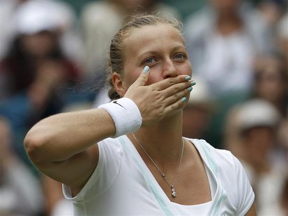 Petra Kvitova of the Czech Republic celebrates after defeating Akgul Amanmuradova of Uzbekistan in their women's singles tennis match at the Petra Kvitova of the Czech Republic celebrates after defeating Akgul Amanmuradova of Uzbekistan in their women's singles tennis match at the