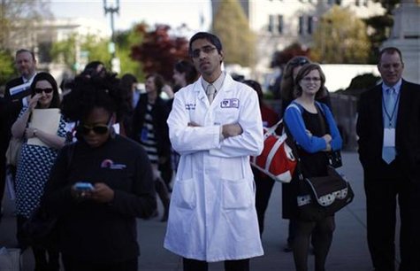 Doctor Vivek Murthy stands among other bystanders during the first day of legal arguments over the Affordable Care Act outside the Supreme C Doctor Vivek Murthy stands among other bystanders during the first day of legal arguments over the Affordable Care Act outside the Supreme C