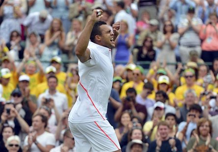 Jo-Wilfried Tsonga of France celebrates defeating Lleyton Hewitt of Australia in their men's singles tennis match at the Wimbledon tennis ch Jo-Wilfried Tsonga of France celebrates defeating Lleyton Hewitt of Australia in their men's singles tennis match at the Wimbledon tennis ch