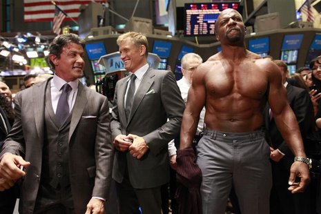 Actor Terry Crews (R) poses shirtless next to his fellow "The Expendables" cast members Sylvester Stallone (L) and Dolph Lundgren (C) for ph Actor Terry Crews (R) poses shirtless next to his fellow "The Expendables" cast members Sylvester Stallone (L) and Dolph Lundgren (C) for ph