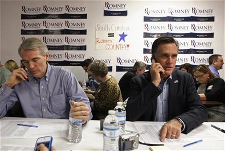 U.S. Republican presidential candidate and former Massachusetts Governor Mitt Romney and Senator Rob Portman (R-OH) call potential voters fr U.S. Republican presidential candidate and former Massachusetts Governor Mitt Romney and Senator Rob Portman (R-OH) call potential voters fr