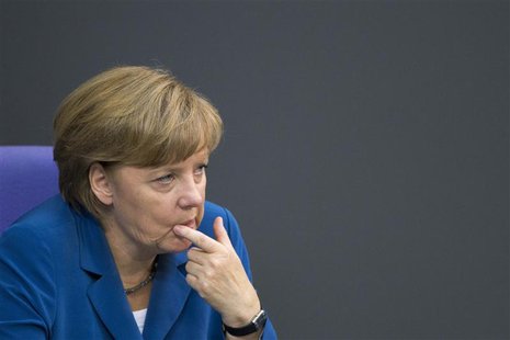 German Chancellor Angela Merkel gestures after she delivers a government policy statement at the lower house of parliament, the Bundestag, i German Chancellor Angela Merkel gestures after she delivers a government policy statement at the lower house of parliament, the Bundestag, i