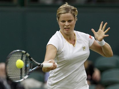 Kim Clijsters of Belgium hits a return to Andrea Hlavackova of the Czech Republic during their women's singles tennis match at the Wimbledon Kim Clijsters of Belgium hits a return to Andrea Hlavackova of the Czech Republic during their women's singles tennis match at the Wimbledon