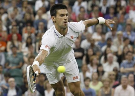 Novak Djokovic of Serbia hits a return to Ryan Harrison of the U.S during their men's singles tennis match at the Wimbledon tennis champions Novak Djokovic of Serbia hits a return to Ryan Harrison of the U.S during their men's singles tennis match at the Wimbledon tennis champions