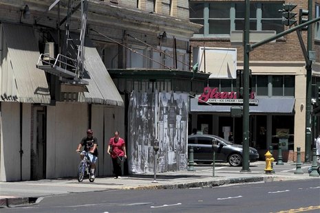 People walk past shuttered businesses in downtown Stockton, California June 27, 2012. REUTERS/Kevin Bartram People walk past shuttered businesses in downtown Stockton, California June 27, 2012. REUTERS/Kevin Bartram