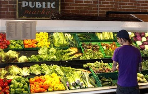 A customer looks over produce at the Phoenix Public Market in Phoenix, Arizona August 23, 2011. REUTERS/Joshua Lott A customer looks over produce at the Phoenix Public Market in Phoenix, Arizona August 23, 2011. REUTERS/Joshua Lott