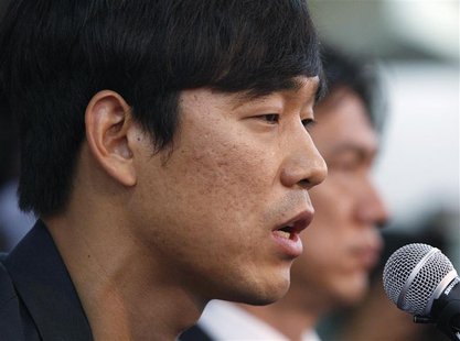 Arsenal striker Park Chu-young (L) speaks next to South Korea's Olympic and national soccer team head coach Hong Myung-bo during a news conf Arsenal striker Park Chu-young (L) speaks next to South Korea's Olympic and national soccer team head coach Hong Myung-bo during a news conf