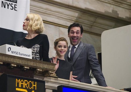 Actors from the show "Mad Men" Jon Hamm (R) and Kiernan Shipka react with January Jones (L) while visiting the New York Stock Exchange to ri Actors from the show "Mad Men" Jon Hamm (R) and Kiernan Shipka react with January Jones (L) while visiting the New York Stock Exchange to ri
