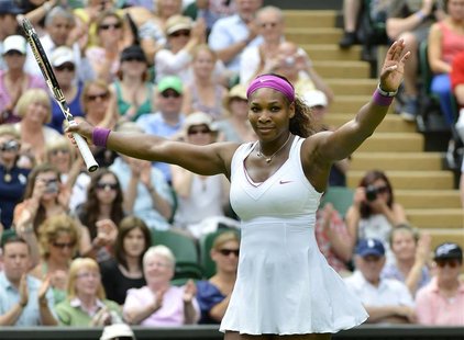 Serena Williams of the U.S. reacts after defeating Melinda Czink of Hungary in their women's singles tennis match at the Wimbledon tennis ch Serena Williams of the U.S. reacts after defeating Melinda Czink of Hungary in their women's singles tennis match at the Wimbledon tennis ch