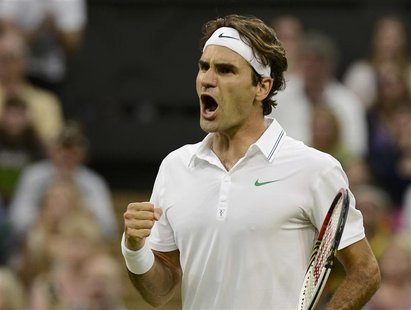 Roger Federer of Switzerland reacts during his men's singles tennis match against Julien Benneteau of France at the Wimbledon tennis champio Roger Federer of Switzerland reacts during his men's singles tennis match against Julien Benneteau of France at the Wimbledon tennis champio