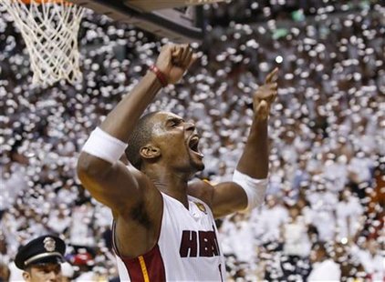 Miami Heat's Chris Bosh celebrates after the Heat defeated the Oklahoma City Thunder in Game 5 of the NBA basketball finals in Miami, Florid Miami Heat's Chris Bosh celebrates after the Heat defeated the Oklahoma City Thunder in Game 5 of the NBA basketball finals in Miami, Florid