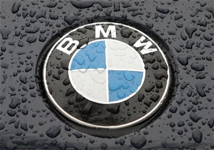 The logo of German car manufacturer BMW is seen on the bonnet of a vehicle covered with water drops in Kiev March 27, 2012. REUTERS/Stringer The logo of German car manufacturer BMW is seen on the bonnet of a vehicle covered with water drops in Kiev March 27, 2012. REUTERS/Stringer