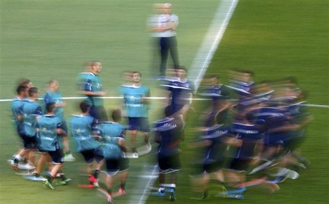 Italy's national soccer players warm-up during a training session at the Olympic stadium in Kiev June 30, 2012. Italy will play against Spai Italy's national soccer players warm-up during a training session at the Olympic stadium in Kiev June 30, 2012. Italy will play against Spai