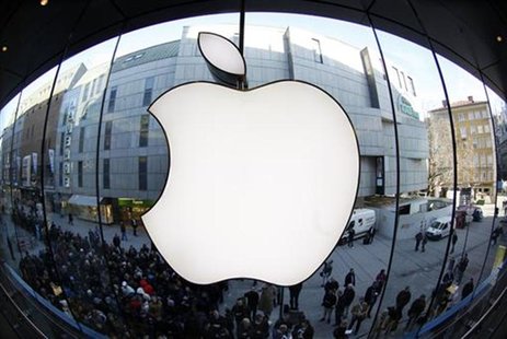 People wait on a street in front of an Apple store as they await sales of the new iPad in the Apple store in Munich March 16, 2012. REUTERS/ People wait on a street in front of an Apple store as they await sales of the new iPad in the Apple store in Munich March 16, 2012. REUTERS/