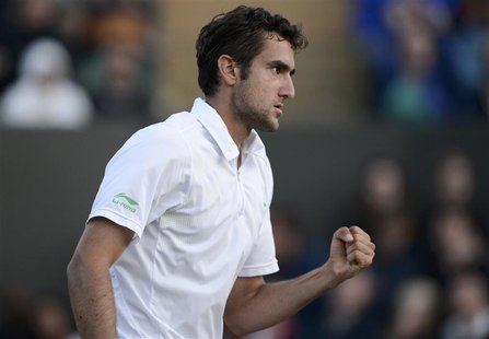 Marin Cilic of Croatia reacts to winning the 16th game in the fifth set during his men's singles tennis match against Sam Querrey of the U.S Marin Cilic of Croatia reacts to winning the 16th game in the fifth set during his men's singles tennis match against Sam Querrey of the U.S