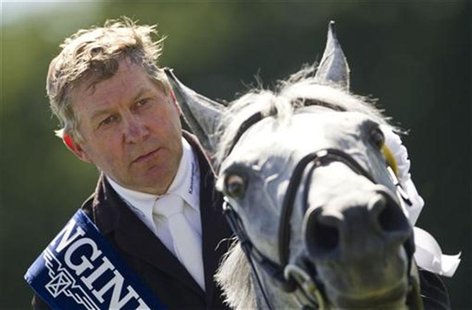 Show jumper Nick Skelton listens to the Britain national anthem after winning at the CSIO Grand Prix of Switzerland in St. Gallen June 5, 20 Show jumper Nick Skelton listens to the Britain national anthem after winning at the CSIO Grand Prix of Switzerland in St. Gallen June 5, 20