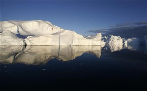 Icebergs are reflected in the calm waters at the mouth of the Jakobshavn ice fjord near Ilulissat in Greenland in this photo taken May 15, 2 Icebergs are reflected in the calm waters at the mouth of the Jakobshavn ice fjord near Ilulissat in Greenland in this photo taken May 15, 2