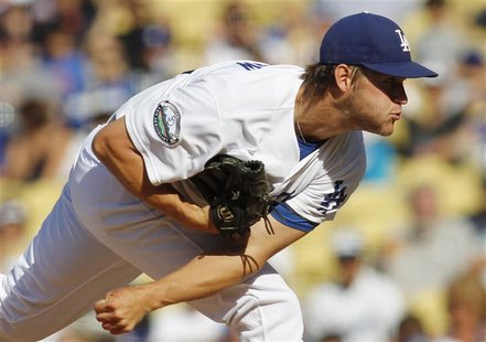 Los Angeles Dodgers starting pitcher Clayton Kershaw delivers against the New York Mets during the first inning of their MLB baseball game i Los Angeles Dodgers starting pitcher Clayton Kershaw delivers against the New York Mets during the first inning of their MLB baseball game i