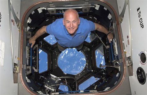 STS-131 commander Alan Poindexter poses for a photo in the Cupola of the International Space Station in this NASA file photograph on April 1 STS-131 commander Alan Poindexter poses for a photo in the Cupola of the International Space Station in this NASA file photograph on April 1