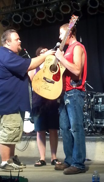 Dylan Raikowski won our autographed guitar
