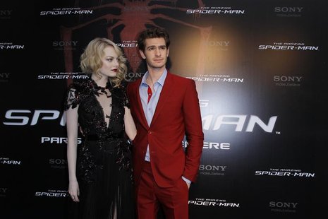 Actor Andrew Garfield (R) and U.S. actress Emma Stone arrive for the French premiere of "The Amazing Spider-Man" in Paris June 19, 2012. REU Actor Andrew Garfield (R) and U.S. actress Emma Stone arrive for the French premiere of "The Amazing Spider-Man" in Paris June 19, 2012. REU